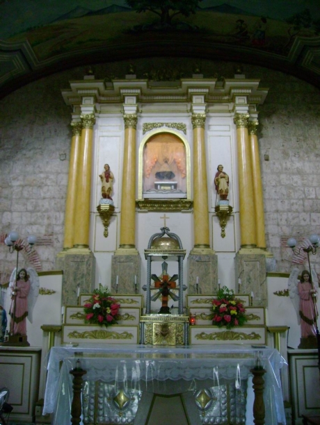 The simply-designed retablo of the centuries-old Church of Caysasay.